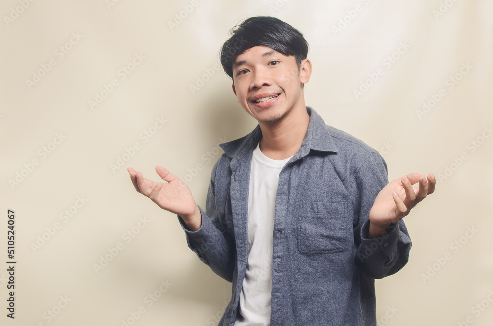 Handsome young man laughing over isolated background Handsome young man laughing over isolated background