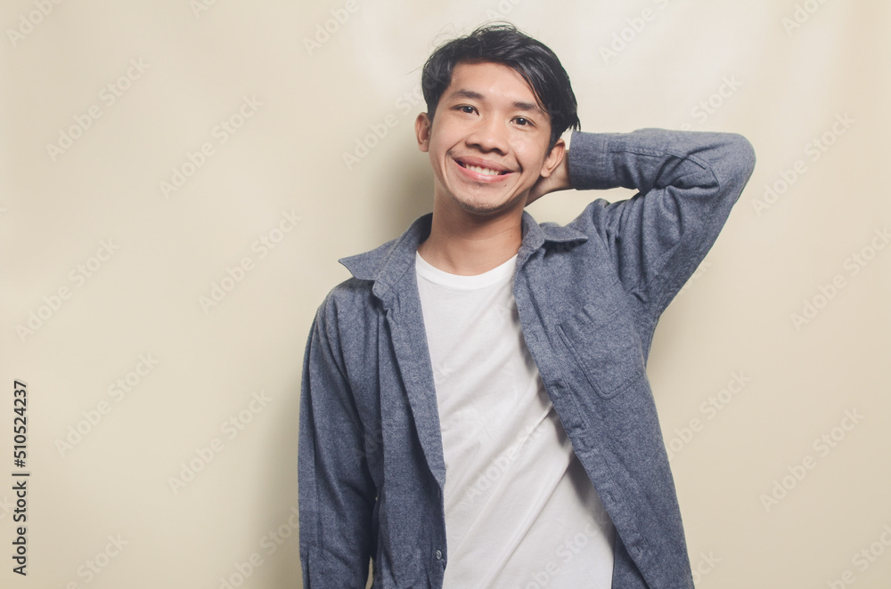 Portrait of attractive Asian man in cheerful casual shirt, positive young man. Portrait of attractive Asian man in cheerful casual shirt, positive young man.