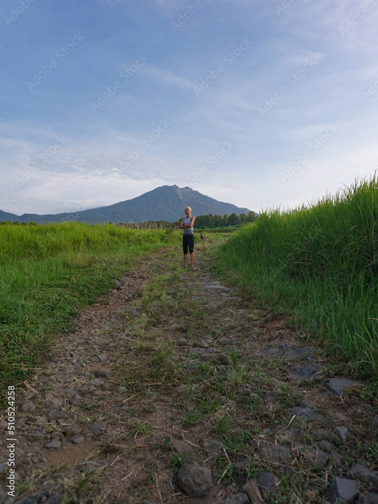 Fototapeta premium A Woman walking around plantation in Banyuwangi, East Java, Indonesia.