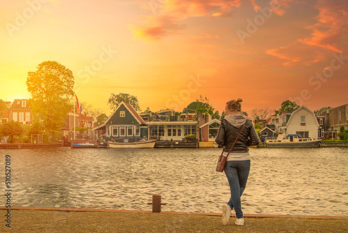 girl walks around the city of Amsterdam.