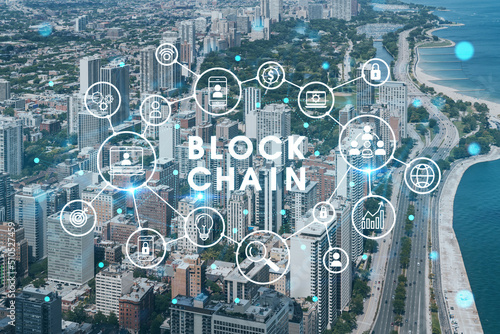 Aerial panorama city view of Chicago downtown area and Lake, day time, Illinois, USA. Birds eye view, skyscrapers, financial district. Decentralized economy. Blockchain, cryptography concept, hologram