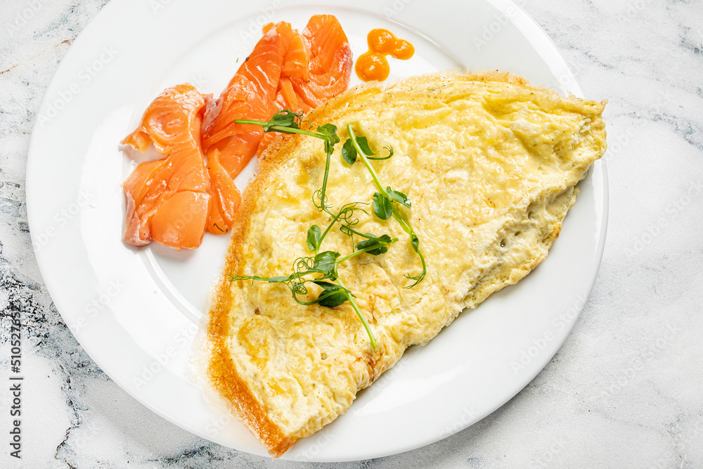 omelet with salmon on the white plate omelet with salmon on the white plate