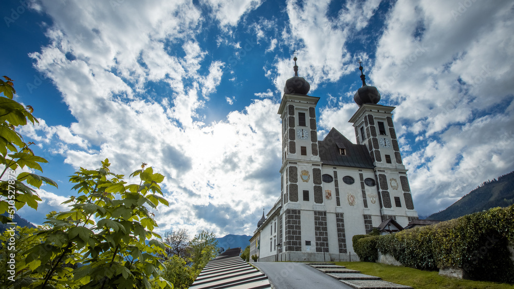 Wallfahrtskirche frauenberg is a beautiful church in the middle of Austria, Frog view of a church next to enn river in central Austria on a sunny summer day.