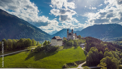 Wallfahrtskirche frauenberg is a beautiful church in the middle of Austria, drone panorama view of a church next to enn river in central Austria on a sunny summer day.
