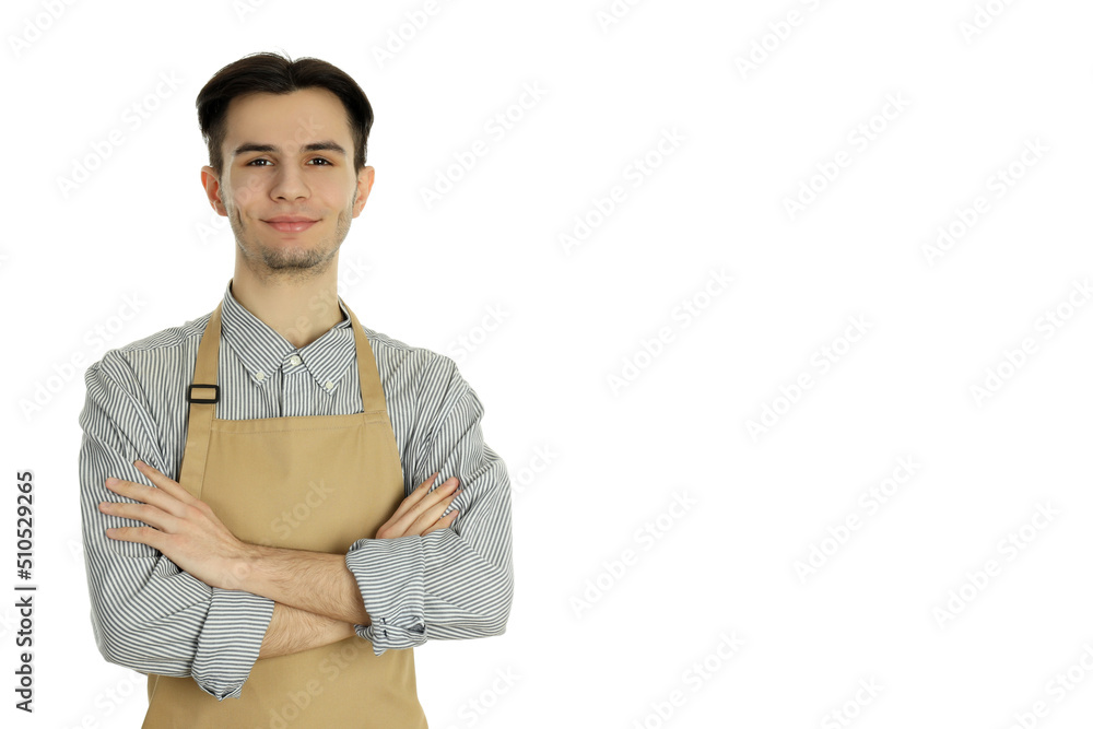 Concept of cooking, young man in apron isolated on white background Concept of cooking, young man in apron isolated on white background