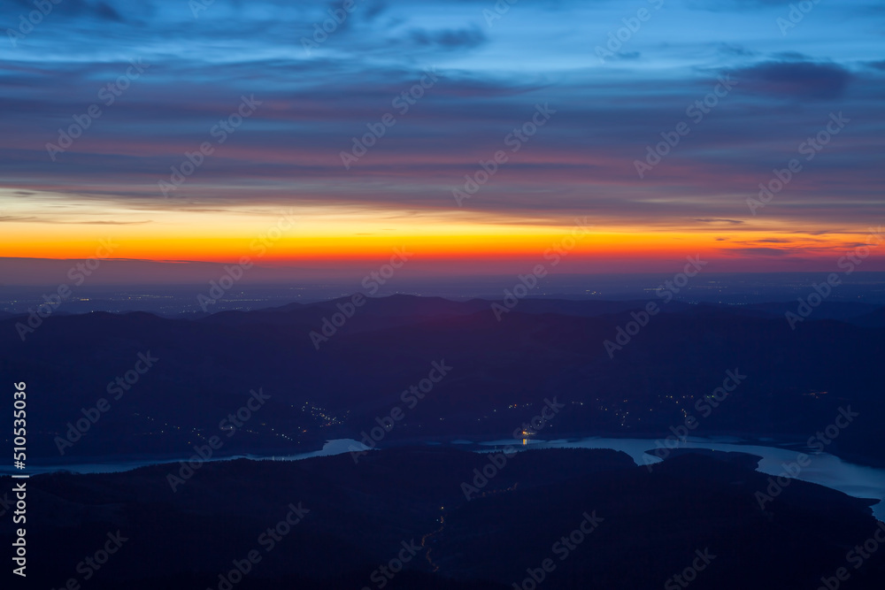 sunset and lake, landscape view from Ceahlau mountain. Romania