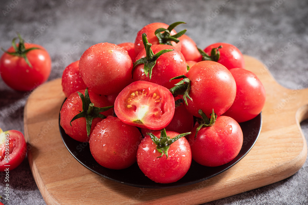 fresh cherry tomatoes in a plate on table fresh cherry tomatoes in a plate on table