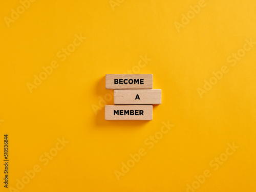The announcement message become a member on wooden blocks. membership and subscription photo