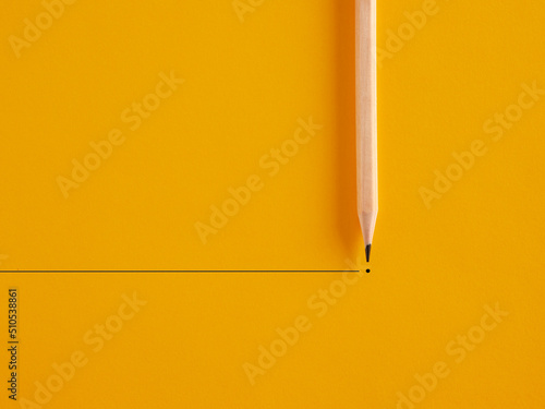 Pencil draws a line and a dot on yellow background. To end or finish something or retirement photo