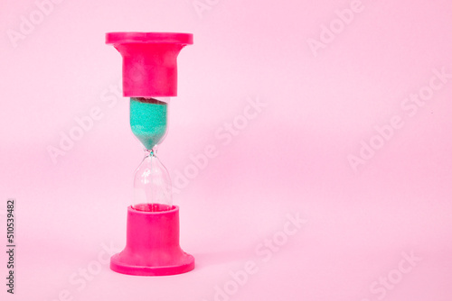 Colorful sand clock with space for text life day concept