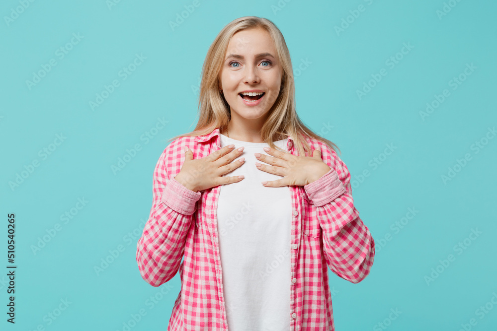 Young surprised fun amazed happy caucasian woman she 30s wear pink shirt white t-shirt look camera put hands on herself isolated on plain pastel light blue background studio. People lifestyle concept Young surprised fun amazed happy caucasian woman she 30s wear pink shirt white t-shirt look camera put hands on herself isolated on plain pastel light blue background studio. People lifestyle concept