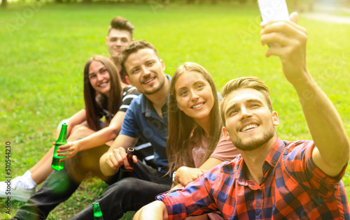 Young friends taking selfie during barbecue picnic
