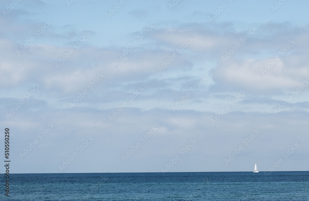 Lonely sailing ship on the wide sea Lonely sailing ship on the wide sea