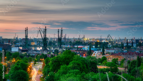 Shipyard cranes in Gdansk at sunset. Poland