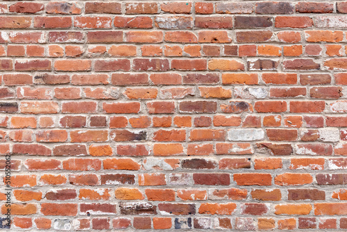 brick wall of an old american building with original bricks from 19th century