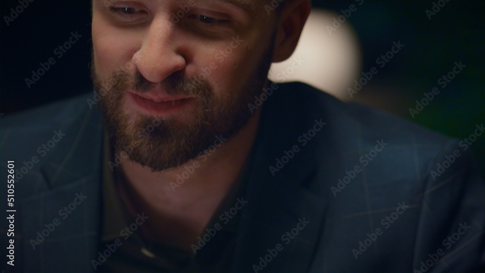 Obraz premium Joyful man eating dinner in luxury restaurant. Handsome gentleman enjoy food.