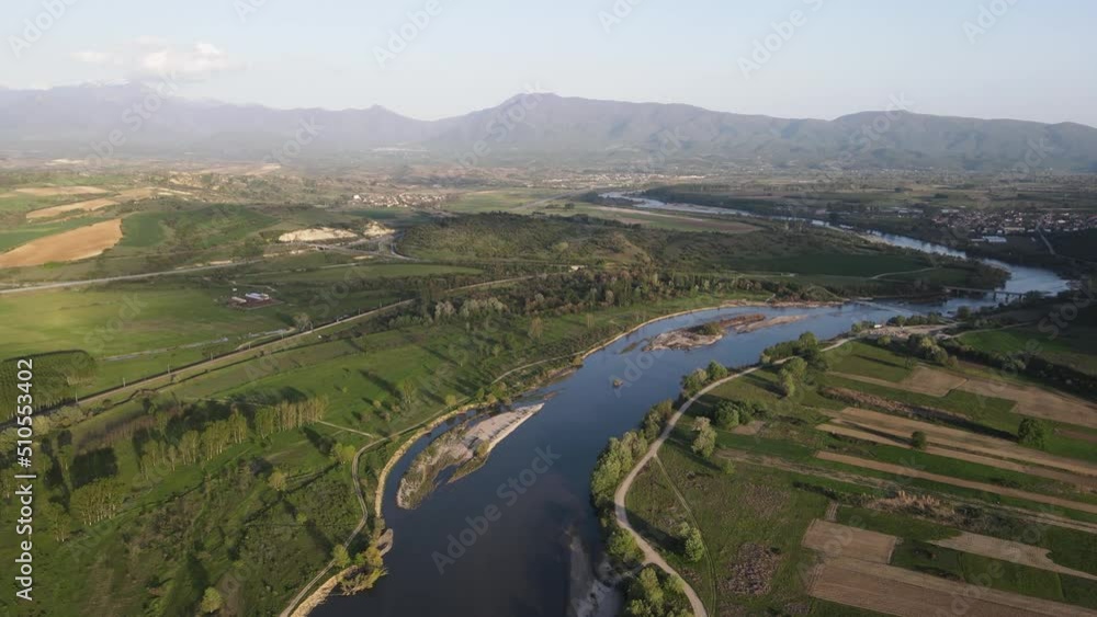 Aerial Sunset view of Struma river passing near village of Topolnitsa, Blagoevgrad region, Bulgaria Aerial Sunset view of Struma river passing near village of Topolnitsa, Blagoevgrad region, Bulgaria