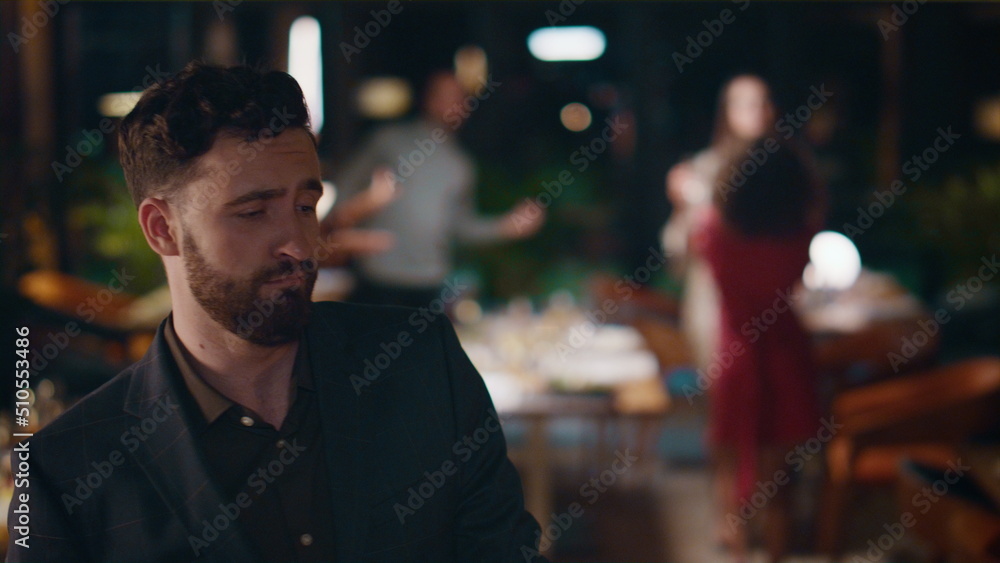 Handsome man dancing celebrating new year on friends meeting party at night bar. Handsome man dancing celebrating new year on friends meeting party at night bar.