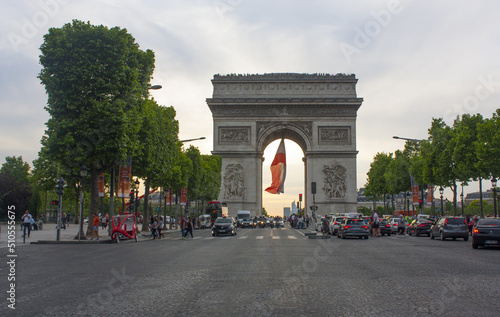 Triumphal Arch on the Champs Elyses at evening in Paris, France photo