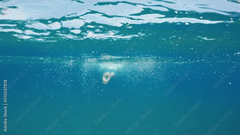 Man swims frog in the open sea. Man swims frog in the open sea.