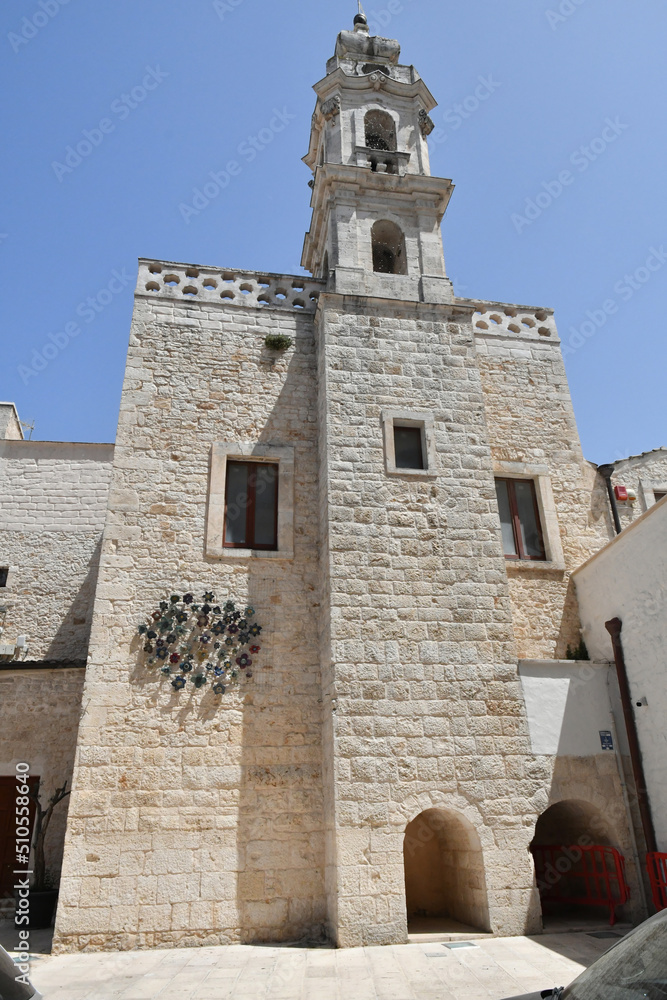 The facade of a townhall in Casamassima, a village with blue-colored houses in the Puglia region of Italy.