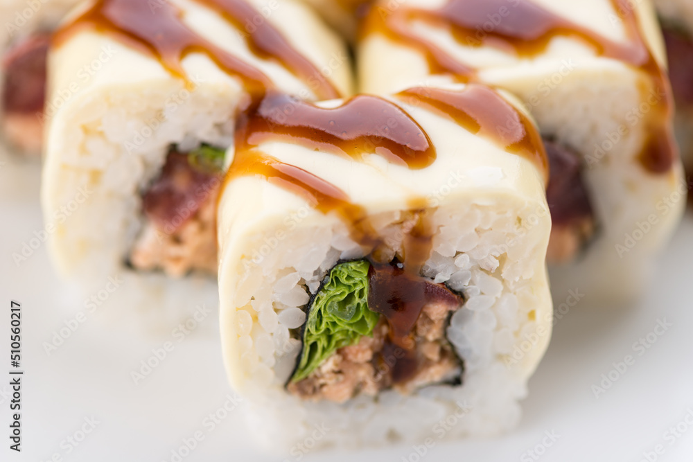 Sushi set and composition at white background. Japanese food restaurant, sushi maki gunkan roll plate or platter set. Sushi set and composition at white background. Japanese food restaurant, sushi maki gunkan roll plate or platter set.