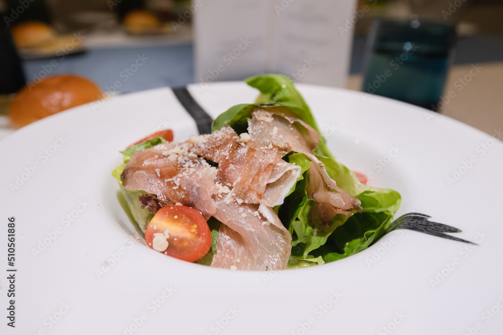 parma ham vegetable salad on white plate parma ham vegetable salad on white plate