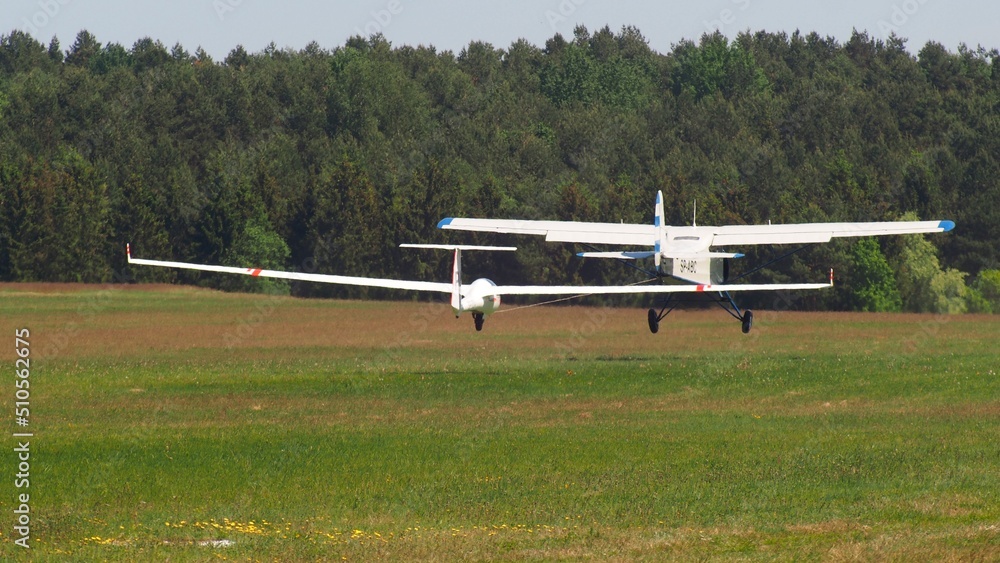 airplane pull glider, strting on a runway airplane pull glider, strting on a runway