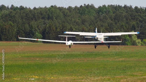 airplane pull glider, strting on a runway