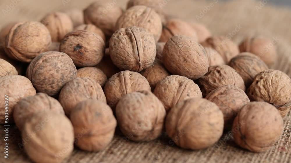 Walnuts background. Walnuts texture. Abstract walnuts heap pattern background Walnuts background. Walnuts texture. Abstract walnuts heap pattern background
