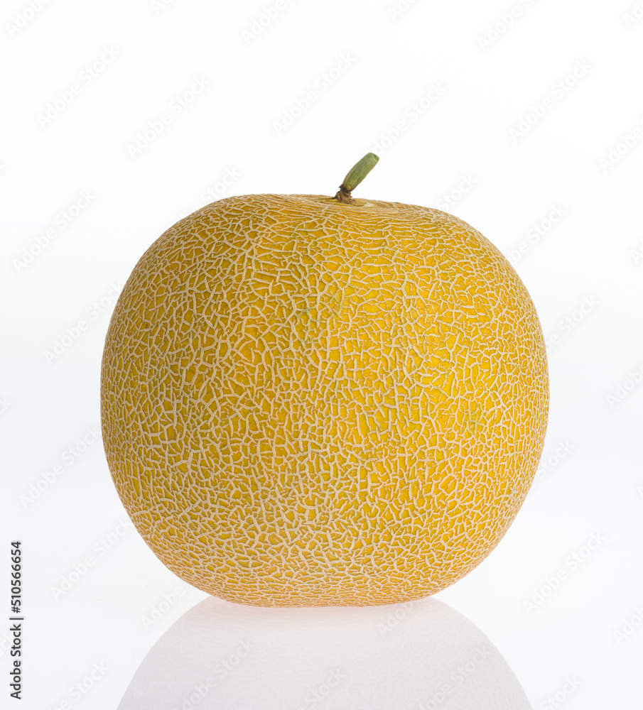 Melon isolated on a white reflective background. Organic sweet yellow melon Melon isolated on a white reflective background. Organic sweet yellow melon