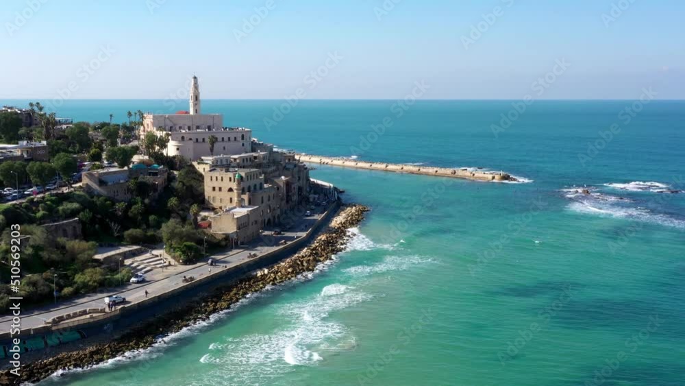 Aerial Shot Of Christian Structure In Old City, Drone Flying Backwards Over Sea - Tel Aviv-Yafo, Israel Aerial Shot Of Christian Structure In Old City, Drone Flying Backwards Over Sea - Tel Aviv-Yafo, Israel