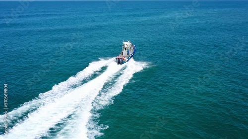 Wallpaper Mural Aerial Panning Shot Of Speed Boat Moving In Blue Sea By City - Tel Aviv-Yafo, Israel Torontodigital.ca
