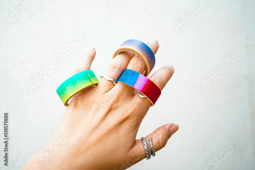 Hand holding a mix of colorful washi tapes