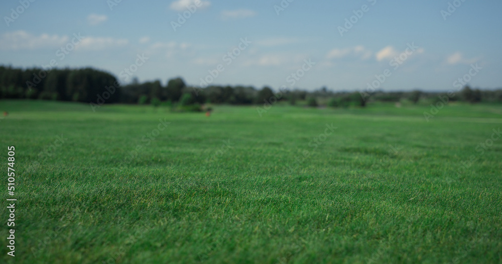 Golf course landscape view at country club. Grass fairway on summer sunny day.