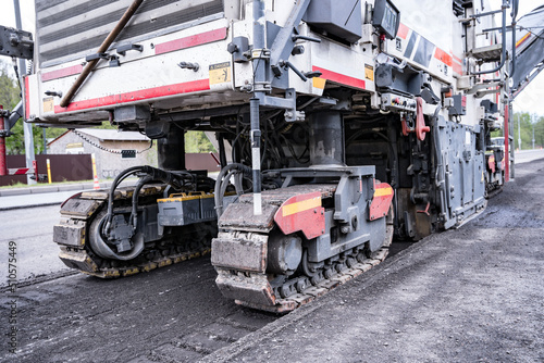  Large Road cold milling machine removes the old asphalt and loading 