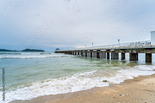 Side view of pier at the beach at sunset time.Thailand. © bubbers