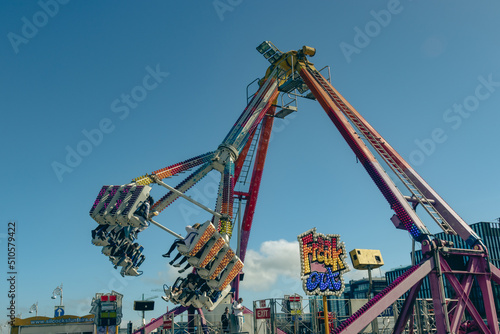 Fun in an amusement park in Dublin during holiday 2022, beautiful blue sky, sunny day in the city, Ireland
