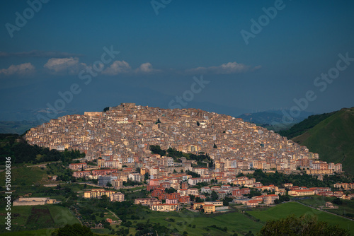 The old town of Gangi in Sicily with the silhouette of Mount Etna in the back