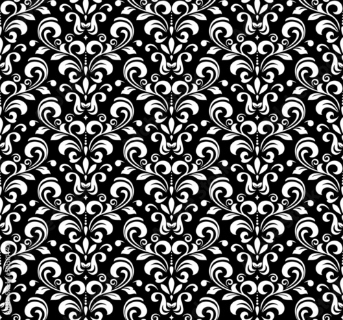 Floral pattern. Vintage wallpaper in the Baroque style. Seamless vector background. White and black ornament for fabric, wallpaper, packaging. Ornate Damask flower ornament