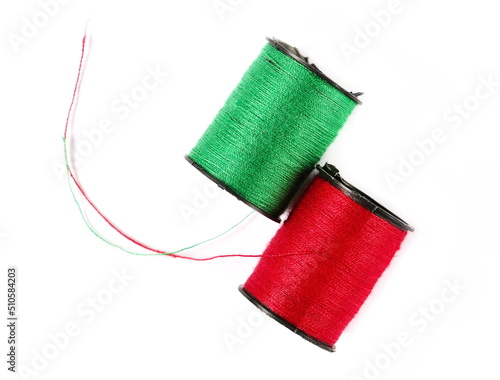 Sewing thread spools isolated on white, top view