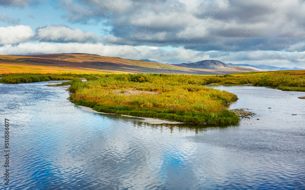 Tundra landscape with river and rolling hills in autumn colors, Alaska