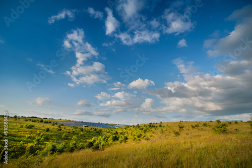 solar panels station, lines of landscapes, blue sky on summer landscape