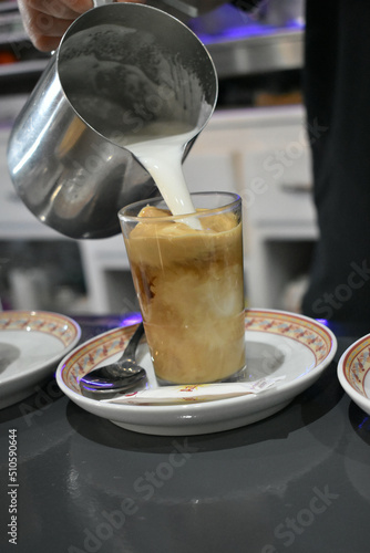 Serving a coffee with milk