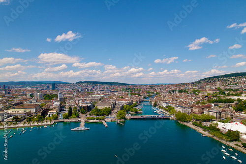Aerial view of City of Zürich with Quay Bridge, River Limmat, Bellevue Square and the medieval old town on a sunny spring day. Photo taken May 30th, 2022, Zurich, Switzerland. © Michael Derrer Fuchs