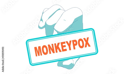Hand holding label with monkeypox disease name inside.