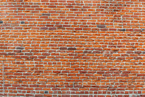 Photo of a old red brick wall for backgrounds or textures.. Photographer Derek Broussard