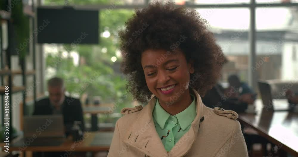 One black female customer waiting for coffee shop service smiling One black female customer waiting for coffee shop service smiling