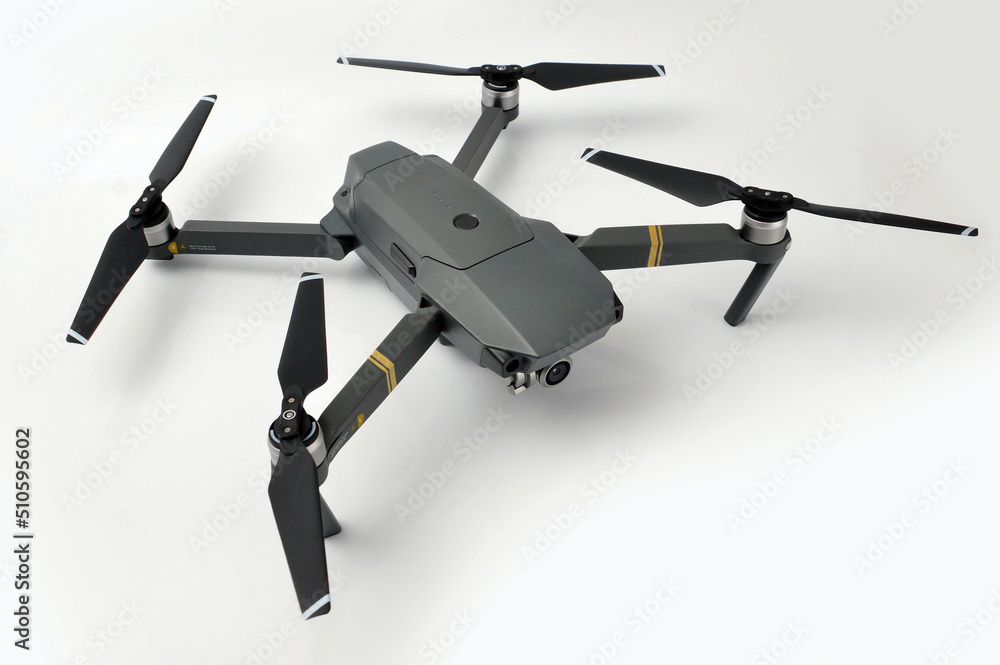 A gray camouflaged drone with a camera used for military espionage isolated. A gray camouflaged drone with a camera used for military espionage isolated.