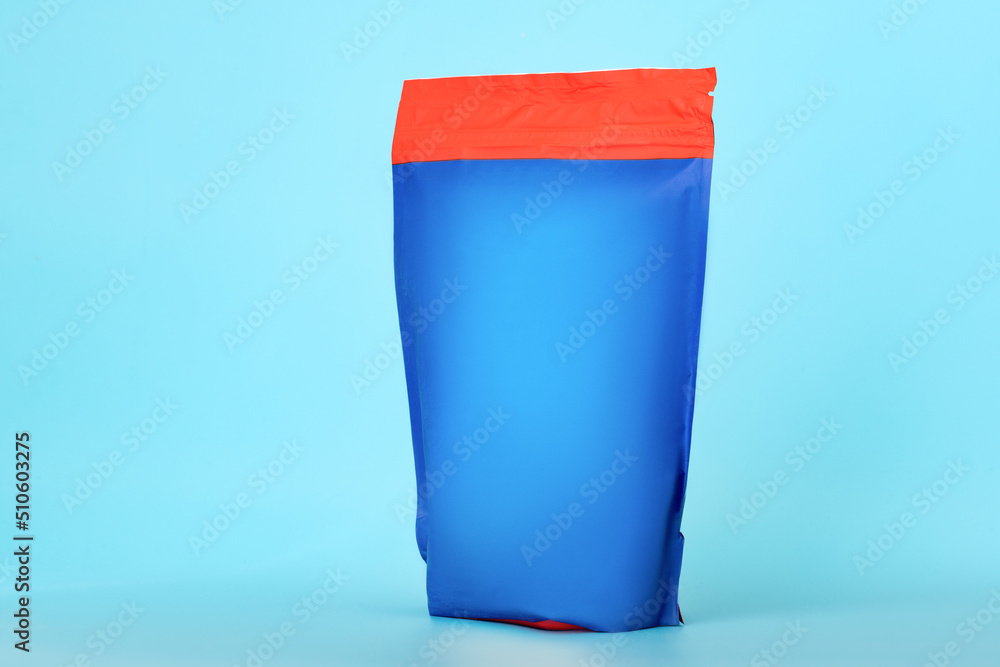 Blank food package on blue background. Snack and nuts bag with zip lock. Retail product and merchandise Blank food package on blue background. Snack and nuts bag with zip lock. Retail product and merchandise